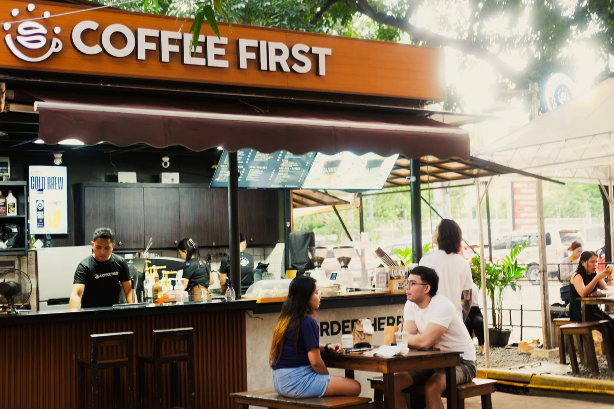 Customers at a Coffee First neighborhood kiosk in Cebu