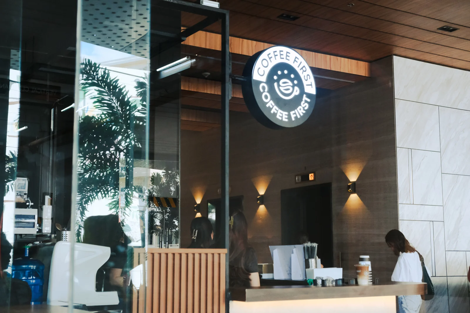 Coffee First The Meridian Kasambagan counter and illuminated logo